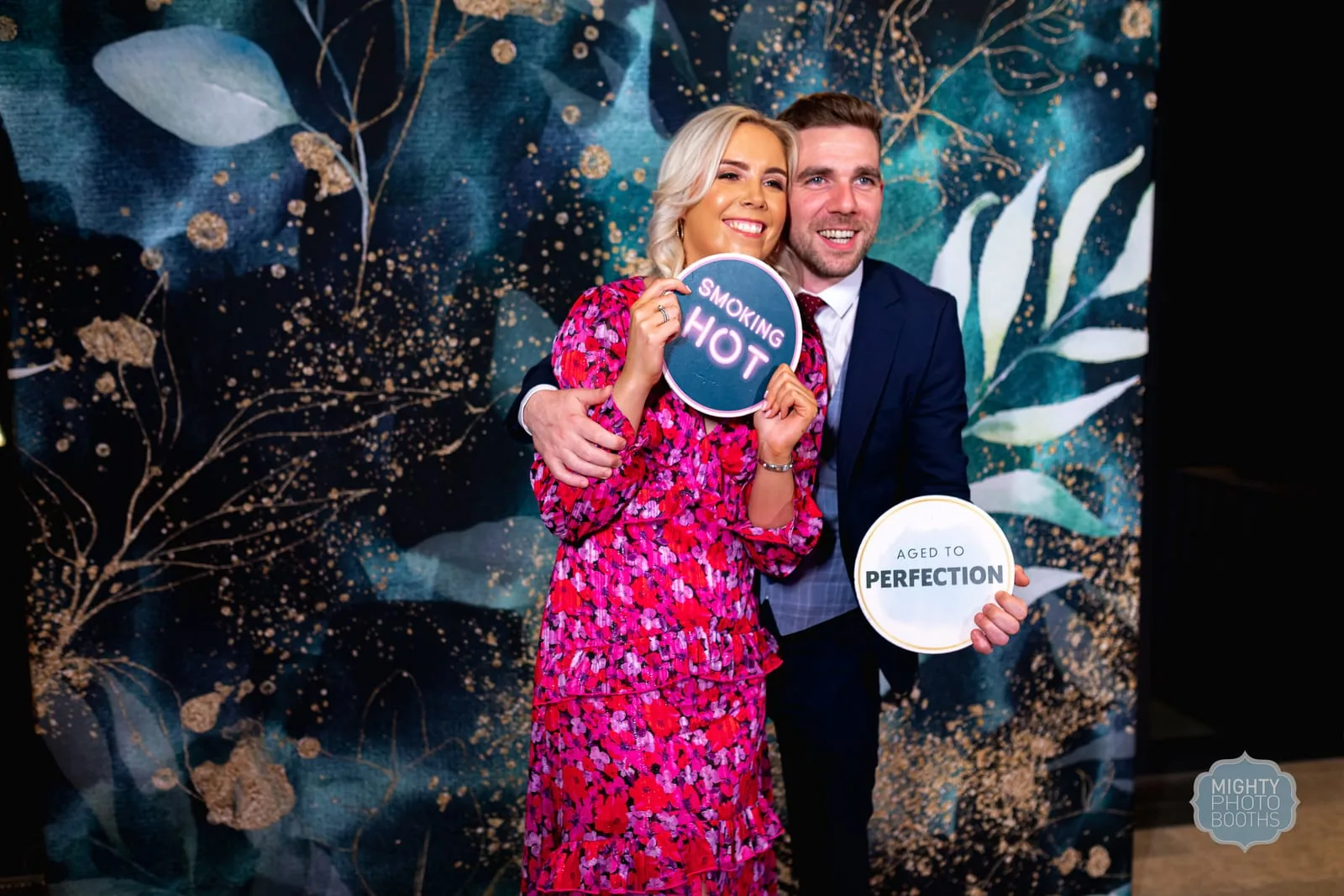 Guests enjoying a finished MIGHTY photo booth experience